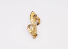 Sagė KASPINĖLIS Aukso spalvos met.  4,5x2 cm.