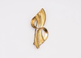 Sagė KASPINĖLIS Aukso spalvos met.  4,5x2 cm.